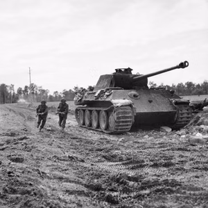 The British Army in Normandy 1944 Men of the Durham Light Infantry, 49th (West Riding) Division 'advance' past a knocked-out German Panther tank during Operation 'Epsom', 27 June 1944.