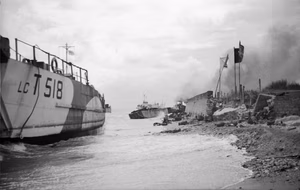 D-day - British Forces during the Invasion of Normandy 6 June 1944 Wrecked landing craft on Nan Red beach, Juno area, at St Aubin-sur-Mer, 6 June 1944. This was the area where 48 (RM) Commando landed, suffering heavy losses when two of their landing craft hit obstacles and sank.
