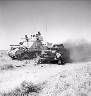 A British M3 Grant tank next to a knocked out a German Panzerkampfwagen I light tank on 6 June 1942 in North Africa.