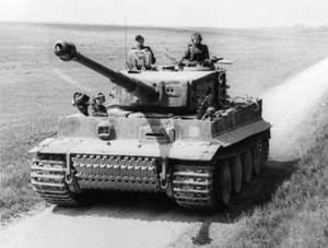 Title : Nordfrankreich, Panzer VI (Tiger I) Extra information : Nordfrankreich.- Panzer VI "Tiger I" des 1. SS-Pz. Korps "Leibstandarte Adolf Hitler" (Turmnummer 323); PK 698 For documentary purposes the German Federal Archive often retained the original image captions , which may be erroneous, biased, obsolete or politically extreme . Factual corrections and alternative descriptions are encouraged separately from the original description. Additionally errors can be reported at this page to inform the Bundesarchiv. Alemannisch | العربية | Boarisch | беларуская | беларуская (тарашкевіца)‎ | català | čeština | Deutsch | English | Esperanto | español | suomi | français | हिन्दी | hrvatski | magyar | italiano | 한국어 | македонски | Plattdüütsch | polski | português | română | русский | sicilianu | slovenčina | slovenščina | svenska | українська | 中文 | 中文（简体）‎ | 中文（繁體）‎ | +/− Original historic description :