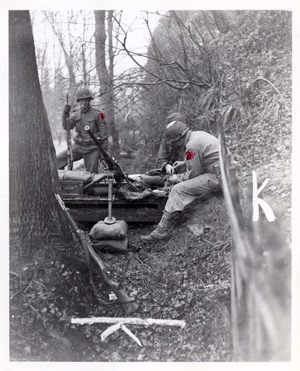 A .50 caliber machine gun and crew are set to repel attack by advancing Germans near Malmedy, 22nd December, 1944. 120th Regiment, 30th Division.