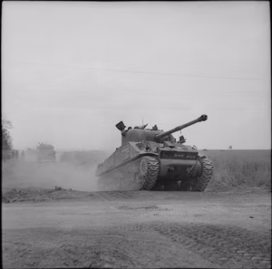 The British Army in the Normandy Campaign 1944 A Sherman Firefly advances during operations in the Odon valley, west of Caen, 16 July 1944.