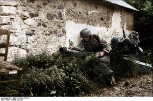 This is a retouched picture , which means that it has been digitally altered from its original version. Modifications: recolored . The original can be viewed here: Bundesarchiv Bild 101I-584-2160-12, Frankreich, Fallschirmjäger mit Panzerabwehrwaffe.jpg : . Modifications made by Ruffneck'88 . .mw-parser-output table.commons-file-information-table,.mw-parser-output .fileinfotpl-type-information,.mw-parser-output .fileinfotpl-type-artwork{border:1px solid var(--border-color-base,#a2a9b1);background-color:var(--background-color-interactive-subtle,#f8f9fa);padding:5px;font-size:95%;border-spacing:2px;box-sizing:border-box;margin:0;width:100%;color:inherit}.mw-parser-output table.commons-file-information-table>tbody>tr,.mw-parser-output .fileinfotpl-type-information>tbody>tr,.mw-parser-output .fileinfotpl-type-artwork>tbody>tr{vertical-align:top}.mw-parser-output table.commons-file-information-table>tbody>tr>td,.mw-parser-output table.commons-file-information-table>tbody>tr>th,.mw-parser-output .fileinfotpl-type-information>tbody>tr>td,.mw-parser-output .fileinfotpl-type-information>tbody>tr>th,.mw-parser-output .fileinfotpl-type-artwork>tbody>tr>td,.mw-parser-output .fileinfotpl-type-artwork>tbody>tr>th{padding:4px}.mw-parser-output .fileinfo-paramfield{background:#ccf;text-align:right;padding-right:0.4em;width:15%;font-weight:bold;color:inherit}.mw-parser-output .commons-file-information-table+table.commons-file-information-table,.mw-parser-output .commons-file-information-table+div.commons-file-information-table>table{border-top:0;padding-top:0;margin-top:-8px}@media only screen and (max-width:719px){.mw-parser-output table.commons-file-information-table,.mw-parser-output .commons-file-information-table .fileinfotpl-type-information,.mw-parser-output .commons-file-information-table .fileinfotpl-type-artwork{border-spacing:0;padding:0;word-break:break-word;width:100%!important}.mw-parser-output .commons-file-information-table>tbody,.mw-parser-output .fileinfotpl-type-information>tbody,.mw-parser-output .fileinfotpl-type-artwork>tbody{display:block}.mw-parser-output .commons-file-information-table>tbody>tr>td,.mw-parser-output .commons-file-information-table>tbody>tr>th,.mw-parser-output .fileinfotpl-type-information>tbody>tr>td,.mw-parser-output .fileinfotpl-type-information>tbody>tr>th,.mw-parser-output .fileinfotpl-type-artwork>tbody>tr>td,.mw-parser-output .fileinfotpl-type-artwork>tbody>tr>th{padding:0.2em 0.4em;text-align:left;text-align:start}.mw-parser-output .commons-file-information-table>tbody>tr,.mw-parser-output .fileinfotpl-type-information>tbody>tr,.mw-parser-output .fileinfotpl-type-artwork>tbody>tr{display:flex;flex-direction:column}.mw-parser-output .commons-file-information-table+table.commons-file-information-table,.mw-parser-output .commons-file-information-table+div.commons-file-information-table>table{margin-top:-1px}.mw-parser-output table .fileinfo-paramfield{box-sizing:border-box;flex:1 0 100%;width:100%}}.mw-parser-output table.commons-file-information-table,.mw-parser-output .fileinfotpl-type-information,.mw-parser-output .fileinfotpl-type-artwork,.mw-parser-output .fileinfo-paramfield{color:var(--color-base,#202122)}html.skin-theme-clientpref-night .mw-parser-output .fileinfo-paramfield{background:#2a2a5c;color:white}html.skin-theme-clientpref-night .mw-parser-output .fileinfotpl-type-artwork tbody>tr>th[style*="#ccf"]{background-color:#2a2a5c!important;color:white}@media screen and (prefers-color-scheme:dark){html.skin-theme-clientpref-os .mw-parser-output .fileinfo-paramfield{background:#2a2a5c;color:white}html.skin-theme-clientpref-os .mw-parser-output .fileinfotpl-type-artwork tbody>tr>th[style*="#ccf"]{background-color:#2a2a5c!important;color:white}} Frankreich, Fallschirmjäger mit Panzerabwehrwaffe ( ) Photographer Reich Archive description InfoField Description provided by the archive when the original description is incomplete or wrong. You can help by reporting errors and typos at Commons:Bundesarchiv/Error reports . Frankreich.- Fallschirmjäger mit Raketenpanzerbüchse ("Ofenrohr" / "Panzerschreck") in Deckung hinter einem Feldstein-Haus in einer Ortschaft; PK Fs AOK Title Frankreich, Fallschirmjäger mit Panzerabwehrwaffe Depicted place France Date 21 June 1944 date QS:P571,+1944-06-21T00:00:00Z/11 Collection German Federal Archives Native name Das Bundesarchiv Parent institution Federal Government Commissioner for Culture and Media Location Koblenz (headquarters) Coordinates 50° 20′ 32.71″ N, 7° 34′ 21.22″ E Established 1946 Website www.bundesarchiv.de Authority file : Q685753 VIAF : 137346469 ISNI : 0000000405552728 LCCN : n92025526 NLA : 36455393 OSM : 1844909 WorldCat institution QS:P195,Q685753 Current location Propagandakompanien der Wehrmacht - Heer und Luftwaffe (Bild 101 I) Accession number Bild 101I-584-2160-12 Source This image was provided to Wikimedia Commons by the German Federal Archive (Deutsches Bundesarchiv) as part of a cooperation project . The German Federal Archive guarantees an authentic representation only using the originals (negative and/or positive), resp. the digitalization of the originals as provided by the Digital Image Archive .