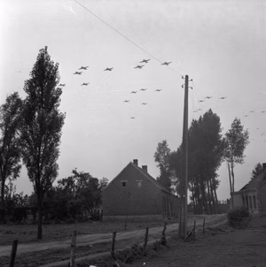 The British Army in North-west Europe 1944-45 C-47 aircraft carrying airborne troops, seen from Gheel, 19 September 1944.
