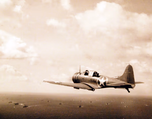 80-G-30216: Operation Torch, November 1942. SBD Dauntless planes from USS Ranger (CV-4) en route to invade French North Africa. A Navy scout bomber flies on anti-submarine patrol. Official U.S. Navy Photograph, now in the collections of the National Archives. (2017/06/06).
