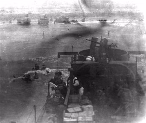 LCI 94, Omaha Beach, Normandy — A medical detachment from the 3rd Battalion, 116th Infantry Regiment, 29th Infantry Division lands at Dog Red, Omaha Beach. This never-before-published image captures some of the chaos of the early morning landings on June 6, 1944.
