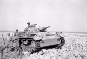 A German Panzer III Ausf.G tank destroyed during the eastern perimeter attack in the Tobruk battle, 14 September 1941. The officer with the field glasses is Lieutenant Colonel J.W. Crawford, commanding officer of the Australian 2/17th infantry battalion. On his right is Major Hodgman.