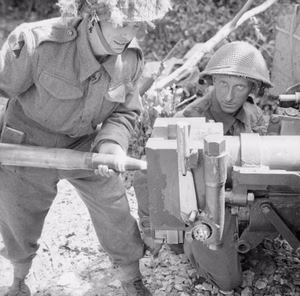 The British Army in Normandy 1944 Men of 2nd Warwickshire Regiment loading a 6-pdr anti-tank gun at Beuville, north of Caen, 20 June 1944.