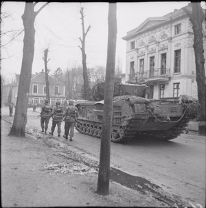 The British Army in North-west Europe 1944-45 Churchill tank of 6th Guards Tank Brigade and infantry of the 2nd Gordon Highlanders in Kleve, 11 February 1945.