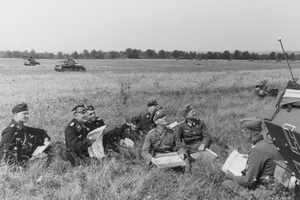 Information added by Wikimedia users. EN Translation: Western campaign, France [June 1940]; Brig. Gen. Erwin Rommel (center) at briefing / studying maps with his officers; 2nd from left Colonel Karl Rothenburg [commander of 25th Panzer Regiment] EN Translation (original caption before Feb. 2016): Brigadier General Rommel [3rd from right]; with the [25th] Panzer Regiment during Western campaign June 1940; 2nd from left Colonel Karl Rothenburg (Knight Cross awarded on 3 June 1940 with the Pour le Mérite); Captain [Adalbert] Schulz, Chief of 1st [battalion of] the 25th Panzer Regiment, later, as a Brigadier General, commander of the 7th Panzer Division.