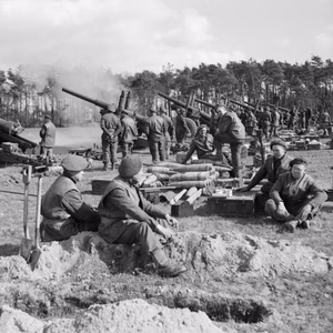 IWM caption : The 5.5-inch guns of 235 and 336 Medium Batteries, Royal Artillery, fire in support of the Rhine crossing .