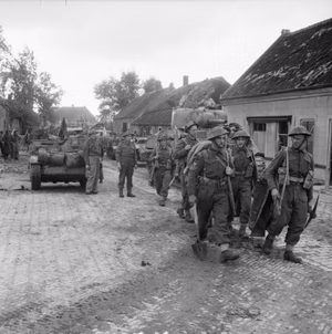 The British Army in North-west Europe 1944-45 Sherman tanks and infantry of 8 Corps in Asten, 24 September 1944.