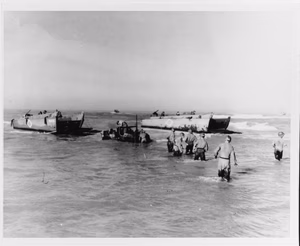 LCVPs from USS Joseph T. Dickman (APA-13) landing vehicles through the surf at Gela, Sicily, on 10-12 July 1943. The truck in the center appears to have stalled. Photograph from the U.S. Coast Guard Collection in the U.S. National Archives.