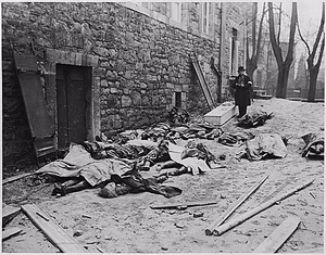 The bodies of Belgium men, women, and children, killed by the Nazis, await indentification before burial. (As the Germans launched a counter offensive into Luxemburg and Belgium, th DPLA aee248a8f81157fd87bb1f23978017f3.gif