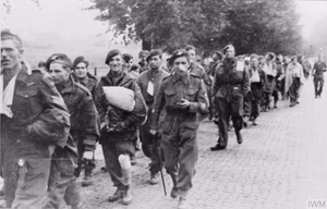 British paratroops being marched away by their German captors. Some 6,400 of the 10,000 British paratroops who landed at Arnhem were taken prisoner, a further 1,100 had been killed.