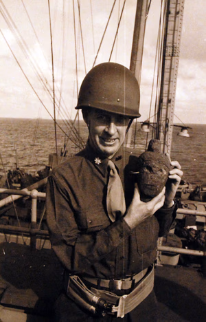 80-G-19889: U.S. Army personnel on a transport during the first part of the U.S. campaign in North Africa. U.S. Army Major is holding a carved stone head. (4/7/2015).