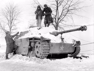 American soldiers of the the 30th Infantry Division inspect an abandoned German Sturmgeschütz III at Géromont, Belgium, in January 1945.