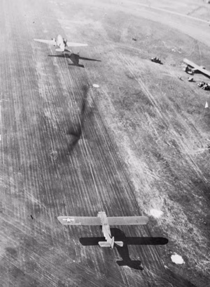IWM caption : OPERATION 'MARKET GARDEN' (THE BATTLE FOR ARNHEM): 17 - 25 SEPTEMBER 1944. An aerial view of a C-47 Dakota as it tows off a CG-4A Waco glider from a British airfield en route for Holland.