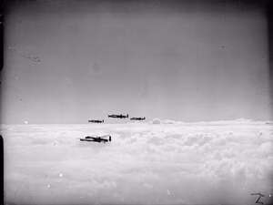 Royal Air Force Bomber Command, 1942-1945. Four Avro Lancasters of No. 514 Squadron RAF flying over complete cloud cover during a daylight attack on fortified villages east of Caen, in support of the Second Army's armoured offensive in the Normandy battle area (Operation GOODWOOD).