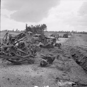 The British Army in Normandy 1944 Wrecked German transport and knocked out tanks on a road in the Falaise-Argentan area, 21 August 1944.
