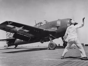 A U.S. Navy Grumman F6F-5 Hellcat of Fighting Squadron 74 (VF-74) is launched during the invasion of Southern France from the decks of the escort carrier USS Kasaan Bay (CVE-69).