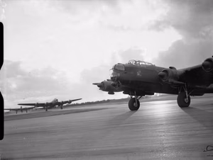 IWM caption : Avro Lancaster B Mark IIs of No. 514 Squadron RAF taxy onto the main runway at Waterbeach , Cambridgeshire, for a daylight attack on fortified villages east of Caen, in support of the Second Army's armoured offensive in the Normandy battle area ( Operation GOODWOOD ).