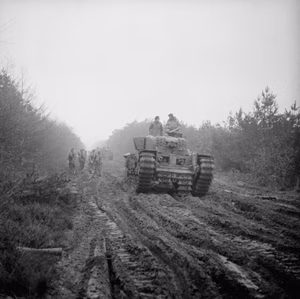 British Tanks and Afvs in Nw Europe 1944-45 A Churchill tank ploughs along a muddy, heavily rutted forest track in the Reichswald during Operation 'Veritable', 8 February 1945.