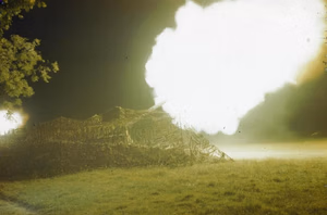 The British Army on the Caen Front in Normandy, July 1944 A camouflaged 155mm gun of 53 Heavy Regiment, Royal Artillery firing during the barrage. The 155mm was an American gun often manned by British troops on the Normandy front.