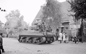 A Sherman tank of 11th Armoured Division passing through Leende, Holland, 22 September 1944. A Sherman tank of 11th Armoured Division passing through Leende, 22 September 1944.