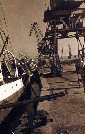 80-G-19921: Damaged ships at Casablanca Harbor, Morocco, during the first days of the U.S. campaign in North Africa. French ship SS Porthos is shown damaged. (4/7/2015).