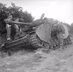 The British Army in the Normandy Campaign 1944 Officers inspect a German Mk IV tank knocked out by the Durham Light Infantry, 11 June 1944.