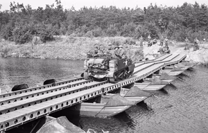 The British Army in North-west Europe 1944-45 Carriers of 1/5th Welch Regiment, 53rd Division, crossing the Meuse into Holland, 20 September 1944.