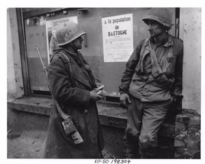 Scope and content: Original caption: Bastogne, Belgium-Weary infantrymen of the 110th Regt., 28th Div., US 1st Army following the German breakthrough in that area. The enemy overran their battalion. (L-R) Pvt. Adam H. Davis and T/S Milford A. Sillars. Dec. 19, 1944