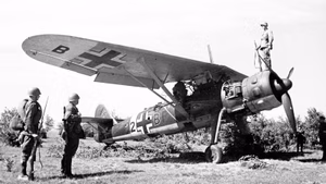 Red Army soldiers of the Western Front at a captured German Henschel Henschel Hs 126 reconnaissance aircraft. The aircraft was shot down and captured by personnel of the 467th Rifle Regiment of the 102nd Rifle Division. The wing code "C2+BP" identifies the aircraft from 6.(H)/Aufkl.Gr. 41 (6th Squadron, 41st Reconnaissance Group. It was shot down by anti-aircraft artillery, most probably in the vicinity of Stary Dovsk (according to German data it was wrongly indicated as Starodub), 11 July 1941.