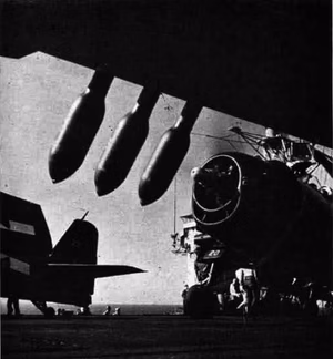 U.S. Navy Grumman F6F-5 Hellcat s of Observation Fighting Squadron 1 (VOF-1) aboard the escort carrier USS Tulagi (CVE-72) during the landings in southern France ("Operation Dragoon") in July or August 1944. Note the British RP-3 rockets in the foreground.