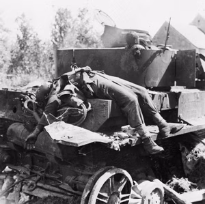 The British Army in Normandy 1944 A knocked-out German PzKpfw IV tank with the burnt bodies of two of its crew in the Falaise pocket, 24 August 1944.