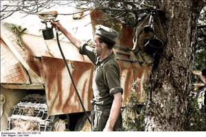 This is a retouched picture , which means that it has been digitally altered from its original version. Modifications: recolored . The original can be viewed here: Bundesarchiv Bild 101I-721-0397-19, Frankreich, Jagdspanther erhält neue Farbe.jpg : . Modifications made by Ruffneck'88 . .mw-parser-output table.commons-file-information-table,.mw-parser-output .fileinfotpl-type-information,.mw-parser-output .fileinfotpl-type-artwork{border:1px solid var(--border-color-base,#a2a9b1);background-color:var(--background-color-interactive-subtle,#f8f9fa);padding:5px;font-size:95%;border-spacing:2px;box-sizing:border-box;margin:0;width:100%;color:inherit}.mw-parser-output table.commons-file-information-table>tbody>tr,.mw-parser-output .fileinfotpl-type-information>tbody>tr,.mw-parser-output .fileinfotpl-type-artwork>tbody>tr{vertical-align:top}.mw-parser-output table.commons-file-information-table>tbody>tr>td,.mw-parser-output table.commons-file-information-table>tbody>tr>th,.mw-parser-output .fileinfotpl-type-information>tbody>tr>td,.mw-parser-output .fileinfotpl-type-information>tbody>tr>th,.mw-parser-output .fileinfotpl-type-artwork>tbody>tr>td,.mw-parser-output .fileinfotpl-type-artwork>tbody>tr>th{padding:4px}.mw-parser-output .fileinfo-paramfield{background:#ccf;text-align:right;padding-right:0.4em;width:15%;font-weight:bold;color:inherit}.mw-parser-output .commons-file-information-table+table.commons-file-information-table,.mw-parser-output .commons-file-information-table+div.commons-file-information-table>table{border-top:0;padding-top:0;margin-top:-8px}@media only screen and (max-width:719px){.mw-parser-output table.commons-file-information-table,.mw-parser-output .commons-file-information-table .fileinfotpl-type-information,.mw-parser-output .commons-file-information-table .fileinfotpl-type-artwork{border-spacing:0;padding:0;word-break:break-word;width:100%!important}.mw-parser-output .commons-file-information-table>tbody,.mw-parser-output .fileinfotpl-type-information>tbody,.mw-parser-output .fileinfotpl-type-artwork>tbody{display:block}.mw-parser-output .commons-file-information-table>tbody>tr>td,.mw-parser-output .commons-file-information-table>tbody>tr>th,.mw-parser-output .fileinfotpl-type-information>tbody>tr>td,.mw-parser-output .fileinfotpl-type-information>tbody>tr>th,.mw-parser-output .fileinfotpl-type-artwork>tbody>tr>td,.mw-parser-output .fileinfotpl-type-artwork>tbody>tr>th{padding:0.2em 0.4em;text-align:left;text-align:start}.mw-parser-output .commons-file-information-table>tbody>tr,.mw-parser-output .fileinfotpl-type-information>tbody>tr,.mw-parser-output .fileinfotpl-type-artwork>tbody>tr{display:flex;flex-direction:column}.mw-parser-output .commons-file-information-table+table.commons-file-information-table,.mw-parser-output .commons-file-information-table+div.commons-file-information-table>table{margin-top:-1px}.mw-parser-output table .fileinfo-paramfield{box-sizing:border-box;flex:1 0 100%;width:100%}}.mw-parser-output table.commons-file-information-table,.mw-parser-output .fileinfotpl-type-information,.mw-parser-output .fileinfotpl-type-artwork,.mw-parser-output .fileinfo-paramfield{color:var(--color-base,#202122)}html.skin-theme-clientpref-night .mw-parser-output .fileinfo-paramfield{background:#2a2a5c;color:white}html.skin-theme-clientpref-night .mw-parser-output .fileinfotpl-type-artwork tbody>tr>th[style*="#ccf"]{background-color:#2a2a5c!important;color:white}@media screen and (prefers-color-scheme:dark){html.skin-theme-clientpref-os .mw-parser-output .fileinfo-paramfield{background:#2a2a5c;color:white}html.skin-theme-clientpref-os .mw-parser-output .fileinfotpl-type-artwork tbody>tr>th[style*="#ccf"]{background-color:#2a2a5c!important;color:white}} Frankreich, Jagdspanther erhält neue Farbe ( ) Photographer Wagner Archive description InfoField Description provided by the archive when the original description is incomplete or wrong. You can help by reporting errors and typos at Commons:Bundesarchiv/Error reports . Frankreich.- Aufsprühen von Tarnfarbe auf einen Jagdpanther (Panzerjäger "Panther"); KBZ Ob. West Title Frankreich, Jagdspanther erhält neue Farbe Depicted place France Date June 1944 date QS:P571,+1944-06-00T00:00:00Z/10 Collection German Federal Archives Native name Das Bundesarchiv Parent institution Federal Government Commissioner for Culture and Media Location Koblenz (headquarters) Coordinates 50° 20′ 32.71″ N, 7° 34′ 21.22″ E Established 1946 Website www.bundesarchiv.de Authority file : Q685753 VIAF : 137346469 ISNI : 0000000405552728 LCCN : n92025526 NLA : 36455393 OSM : 1844909 WorldCat institution QS:P195,Q685753 Current location Propagandakompanien der Wehrmacht - Heer und Luftwaffe (Bild 101 I) Accession number Bild 101I-721-0397-19 Source This image was provided to Wikimedia Commons by the German Federal Archive (Deutsches Bundesarchiv) as part of a cooperation project . The German Federal Archive guarantees an authentic representation only using the originals (negative and/or positive), resp. the digitalization of the originals as provided by the Digital Image Archive .