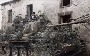This is a retouched picture , which means that it has been digitally altered from its original version. Modifications: recolored . The original can be viewed here: Bundesarchiv Bild 101I-301-1955-22, Nordfrankreich, Panzer V (Panther) mit Infanterie.jpg : . Modifications made by Ruffneck88 . .mw-parser-output table.commons-file-information-table,.mw-parser-output .fileinfotpl-type-information,.mw-parser-output .fileinfotpl-type-artwork{border:1px solid var(--border-color-base,#a2a9b1);background-color:var(--background-color-interactive-subtle,#f8f9fa);padding:5px;font-size:95%;border-spacing:2px;box-sizing:border-box;margin:0;width:100%;color:inherit}.mw-parser-output table.commons-file-information-table>tbody>tr,.mw-parser-output .fileinfotpl-type-information>tbody>tr,.mw-parser-output .fileinfotpl-type-artwork>tbody>tr{vertical-align:top}.mw-parser-output table.commons-file-information-table>tbody>tr>td,.mw-parser-output table.commons-file-information-table>tbody>tr>th,.mw-parser-output .fileinfotpl-type-information>tbody>tr>td,.mw-parser-output .fileinfotpl-type-information>tbody>tr>th,.mw-parser-output .fileinfotpl-type-artwork>tbody>tr>td,.mw-parser-output .fileinfotpl-type-artwork>tbody>tr>th{padding:4px}.mw-parser-output .fileinfo-paramfield{background:#ccf;text-align:right;padding-right:0.4em;width:15%;font-weight:bold;color:inherit}.mw-parser-output .commons-file-information-table+table.commons-file-information-table,.mw-parser-output .commons-file-information-table+div.commons-file-information-table>table{border-top:0;padding-top:0;margin-top:-8px}@media only screen and (max-width:719px){.mw-parser-output table.commons-file-information-table,.mw-parser-output .commons-file-information-table .fileinfotpl-type-information,.mw-parser-output .commons-file-information-table .fileinfotpl-type-artwork{border-spacing:0;padding:0;word-break:break-word;width:100%!important}.mw-parser-output .commons-file-information-table>tbody,.mw-parser-output .fileinfotpl-type-information>tbody,.mw-parser-output .fileinfotpl-type-artwork>tbody{display:block}.mw-parser-output .commons-file-information-table>tbody>tr>td,.mw-parser-output .commons-file-information-table>tbody>tr>th,.mw-parser-output .fileinfotpl-type-information>tbody>tr>td,.mw-parser-output .fileinfotpl-type-information>tbody>tr>th,.mw-parser-output .fileinfotpl-type-artwork>tbody>tr>td,.mw-parser-output .fileinfotpl-type-artwork>tbody>tr>th{padding:0.2em 0.4em;text-align:left;text-align:start}.mw-parser-output .commons-file-information-table>tbody>tr,.mw-parser-output .fileinfotpl-type-information>tbody>tr,.mw-parser-output .fileinfotpl-type-artwork>tbody>tr{display:flex;flex-direction:column}.mw-parser-output .commons-file-information-table+table.commons-file-information-table,.mw-parser-output .commons-file-information-table+div.commons-file-information-table>table{margin-top:-1px}.mw-parser-output table .fileinfo-paramfield{box-sizing:border-box;flex:1 0 100%;width:100%}}.mw-parser-output table.commons-file-information-table,.mw-parser-output .fileinfotpl-type-information,.mw-parser-output .fileinfotpl-type-artwork,.mw-parser-output .fileinfo-paramfield{color:var(--color-base,#202122)}html.skin-theme-clientpref-night .mw-parser-output .fileinfo-paramfield{background:#2a2a5c;color:white}html.skin-theme-clientpref-night .mw-parser-output .fileinfotpl-type-artwork tbody>tr>th[style*="#ccf"]{background-color:#2a2a5c!important;color:white}@media screen and (prefers-color-scheme:dark){html.skin-theme-clientpref-os .mw-parser-output .fileinfo-paramfield{background:#2a2a5c;color:white}html.skin-theme-clientpref-os .mw-parser-output .fileinfotpl-type-artwork tbody>tr>th[style*="#ccf"]{background-color:#2a2a5c!important;color:white}} Nordfrankreich, Panzer V (Panther) mit Infanterie ( ) Photographer Kurth Archive description InfoField Description provided by the archive when the original description is incomplete or wrong. You can help by reporting errors and typos at Commons:Bundesarchiv/Error reports . Frankreich-Nord.- Deutsche Soldaten auf einem getarnten Panzer V "Panther" in Ortschaft; PK 698 Title Nordfrankreich, Panzer V (Panther) mit Infanterie Depicted place Nordfrankreich Date 21 June 1944 date QS:P571,+1944-06-21T00:00:00Z/11 Collection German Federal Archives Native name Das Bundesarchiv Parent institution Federal Government Commissioner for Culture and Media Location Koblenz (headquarters) Coordinates 50° 20′ 32.71″ N, 7° 34′ 21.22″ E Established 1946 Website www.bundesarchiv.de Authority file : Q685753 VIAF : 137346469 ISNI : 0000000405552728 LCCN : n92025526 NLA : 36455393 OSM : 1844909 WorldCat institution QS:P195,Q685753 Current location Propagandakompanien der Wehrmacht - Heer und Luftwaffe (Bild 101 I) Accession number Bild 101I-301-1955-22 Source This image was provided to Wikimedia Commons by the German Federal Archive (Deutsches Bundesarchiv) as part of a cooperation project . The German Federal Archive guarantees an authentic representation only using the originals (negative and/or positive), resp. the digitalization of the originals as provided by the Digital Image Archive .
