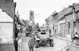 Canadian Daimler and Humber armoured cars in the Belgian-Dutch border town of Putte, during the Anglo-Canadian drive to cut off the German 15th Army on the islands of the Scheldt Estuary.