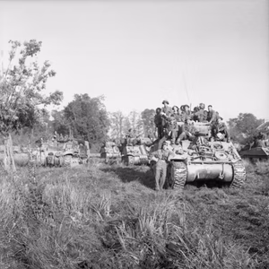 Sherman tanks carrying infantry wait to advance at the start of Operation 'Goodwood', Normandy, 18 July 1944. Sherman tanks carrying infantry wait to advance at the start of Operation 'Goodwood', 18 July 1944.