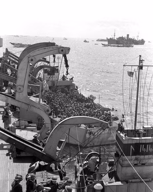 A second section of infantrymen preparing to go ashore from H.M.C.S. PRINCE DAVID off Bernières-sur-Mer, France, 6 June 1944.