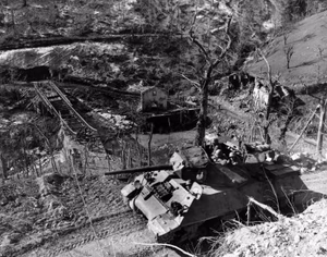 This U.S. Army photo was taken 3 March 1945 in the Monte Terminale area of Italy during the campaign in the North Apennines. It shows an M-10 tank destroyer of the 701st Tank Destroyer Battalion (U.S. Fifth Army), as it advances along a mountain road in support of the 10th Mountain Division, which is pushing north from Poretta on Route 64 toward the Po Valley.