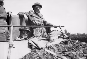 Guardsmen of 3rd Irish Guards in a Loyd carrier, wrapped up against the clouds of dust, during Operation 'Goodwood', Normandy, 18 July 1944. Guardsmen of 3rd Irish Guards in a Loyd carrier, wrapped up against the clouds of dust, during Operation 'Goodwood', 18 July 1944.