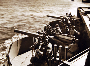 80-G-30309: Operation Torch, November 1942. Gunnery, 40mm guns, during the U.S. Campaign in North Africa. Gun crews on an aircraft carrier after an “alert” has been sounded on the way to North Africa. Official U.S. Navy Photograph, now in the collections of the National Archives. (2017/06/06).