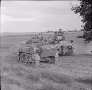 The British Army in Normandy 1944 A Stuart and Sherman tanks of 33rd Armoured Brigade during Operation 'Charnwood', the attack on Caen, 8 July 1944.