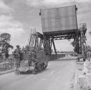 The British Army in the Normandy Campaign 1944 A heavily laden universal carrier crosses 'Pegasus Bridge', the lifting bridge over the Caen Canal captured by glider assault in the early hours of D-Day.