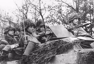 Bundesarchiv: German soldiers in Schützenpanzer (halftrack) during Ardennenoffensive