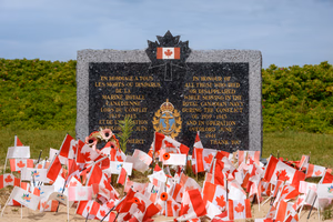 Juno Beach was one of five beaches of the Allied invasion of German-occupied France in the Normandy landings on 6 June 1944 during the Second World War. Taking Juno was the responsibility of the Canadian Army, with sea transport, mine sweeping, and a naval bombardment force provided by the Royal Canadian Navy and the British Royal Navy as well as elements from the Free French, Norwegian, and other Allied navies. The objectives of the 3rd Canadian Infantry Division on D-Day were to cut the Caen-Bayeux road, seize the Carpiquet airport west of Caen, and form a link between the two British beaches on either flank.