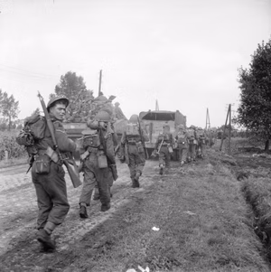 The British Army in North-west Europe 1944-45 Tanks and infantry approaching Asten in Holland, 24 September 1944.