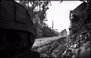 The British Army in the Normandy Campaign 1944 Sherman tanks of the 1st Nottinghamshire Yeomanry (Sherwood Rangers), 8th Armoured Brigade, advance past a knocked-out Tiger tank at Rauray, near Tilly-sur-Seulles, during Operation 'Epsom', 28 June 1944.